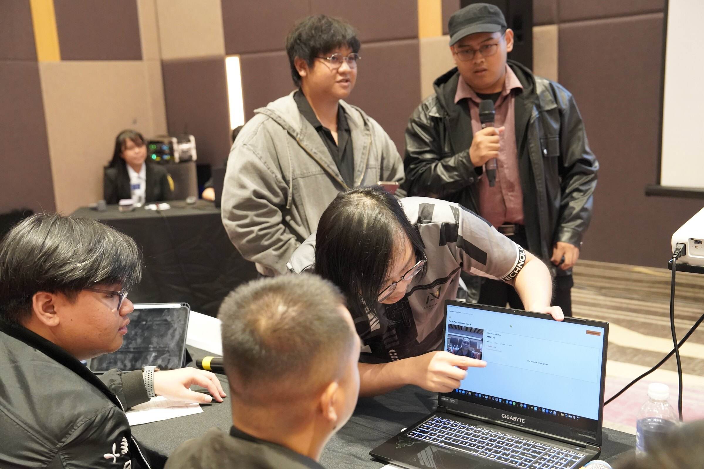 The team walking judges through the system on a laptop