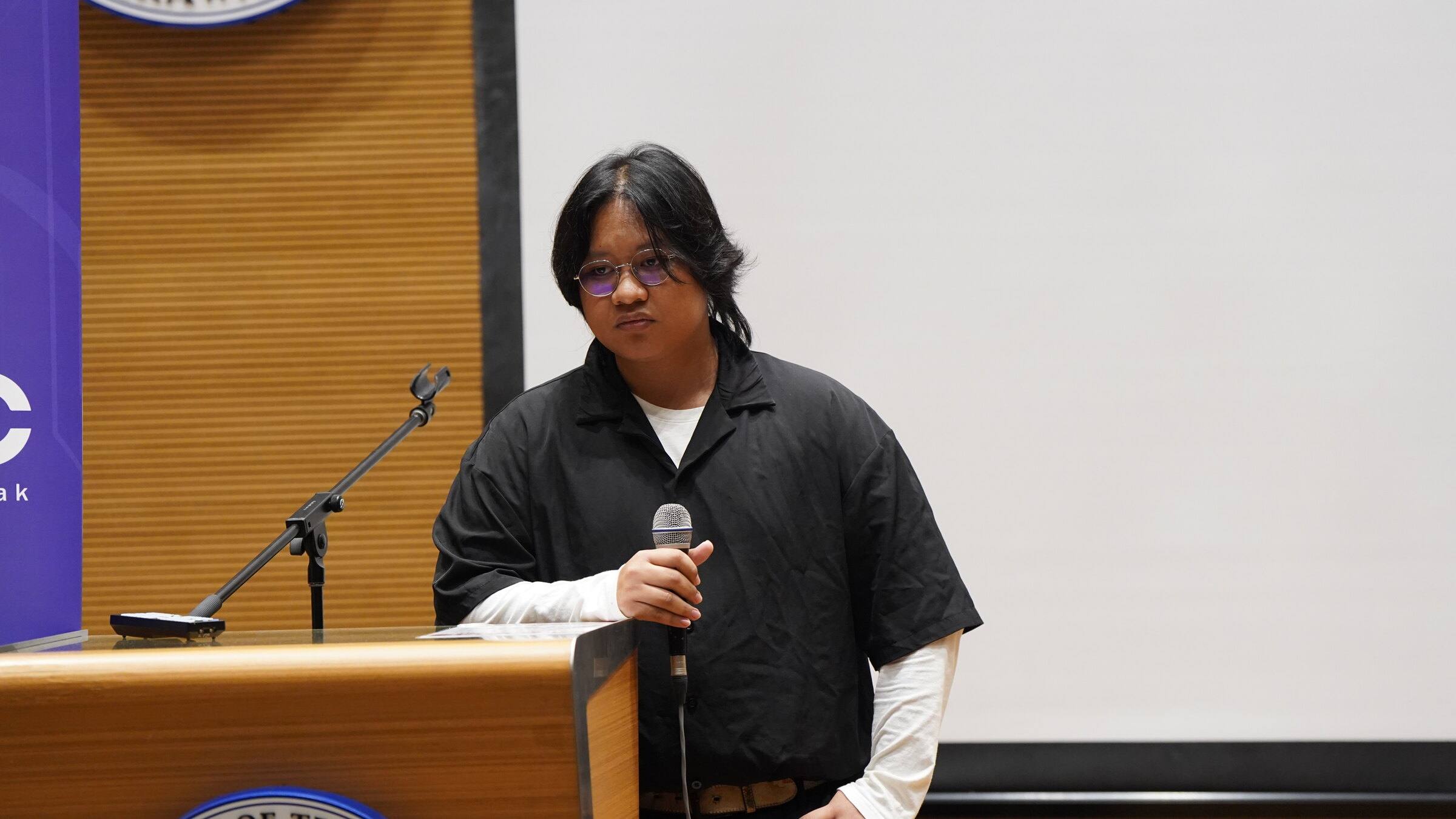 An Aurumvelle team member pitching at the podium during the Tech Frontier Explorer × SCENT programme in March 2026